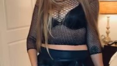 The mistress demonstrates her pink strap on